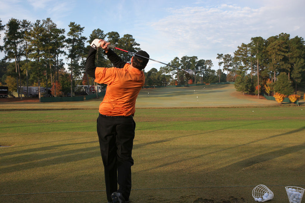 Man taking a swing on Atlanta golf course